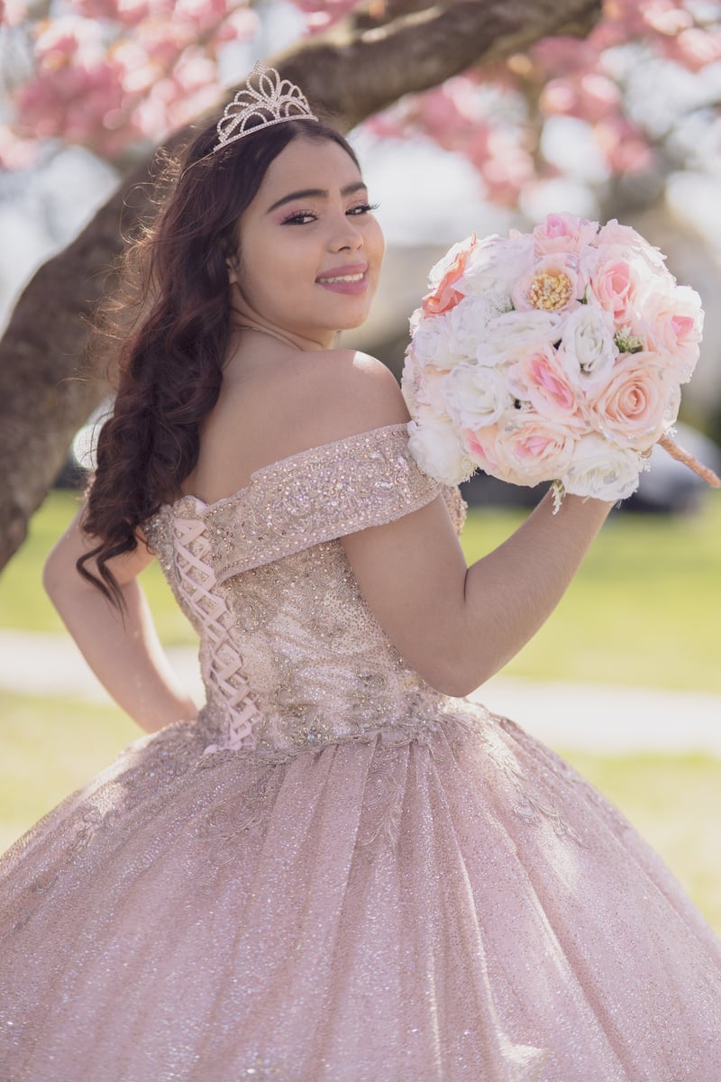 Teenage Girl in Pink Gown Looking Over Her Shoulder